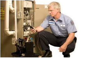 Man determining whether to repair or replace your furnace